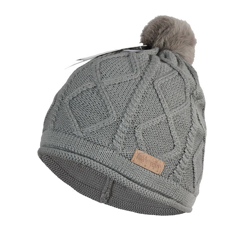 Grey hat with pressed leather lable and rabbit fur pompon